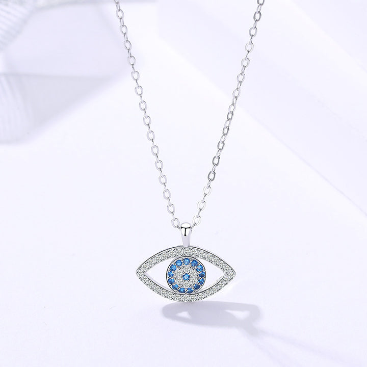 Silver evil eye pendant necklace with blue zircon