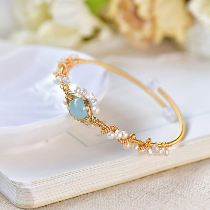 Gold braided wire cuff bracelet with pearls